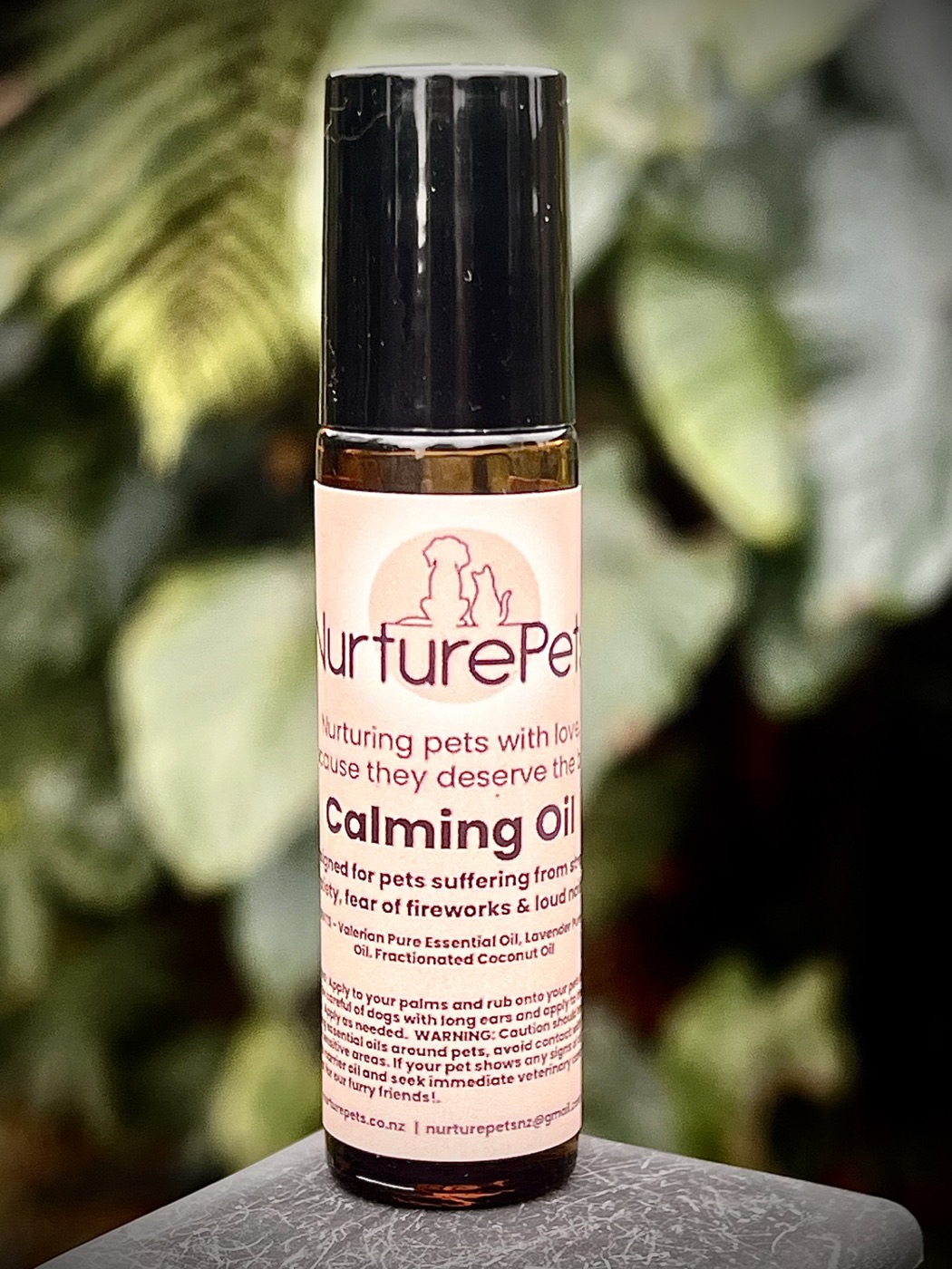Nurture Pets Calming essential oil roller on foliage