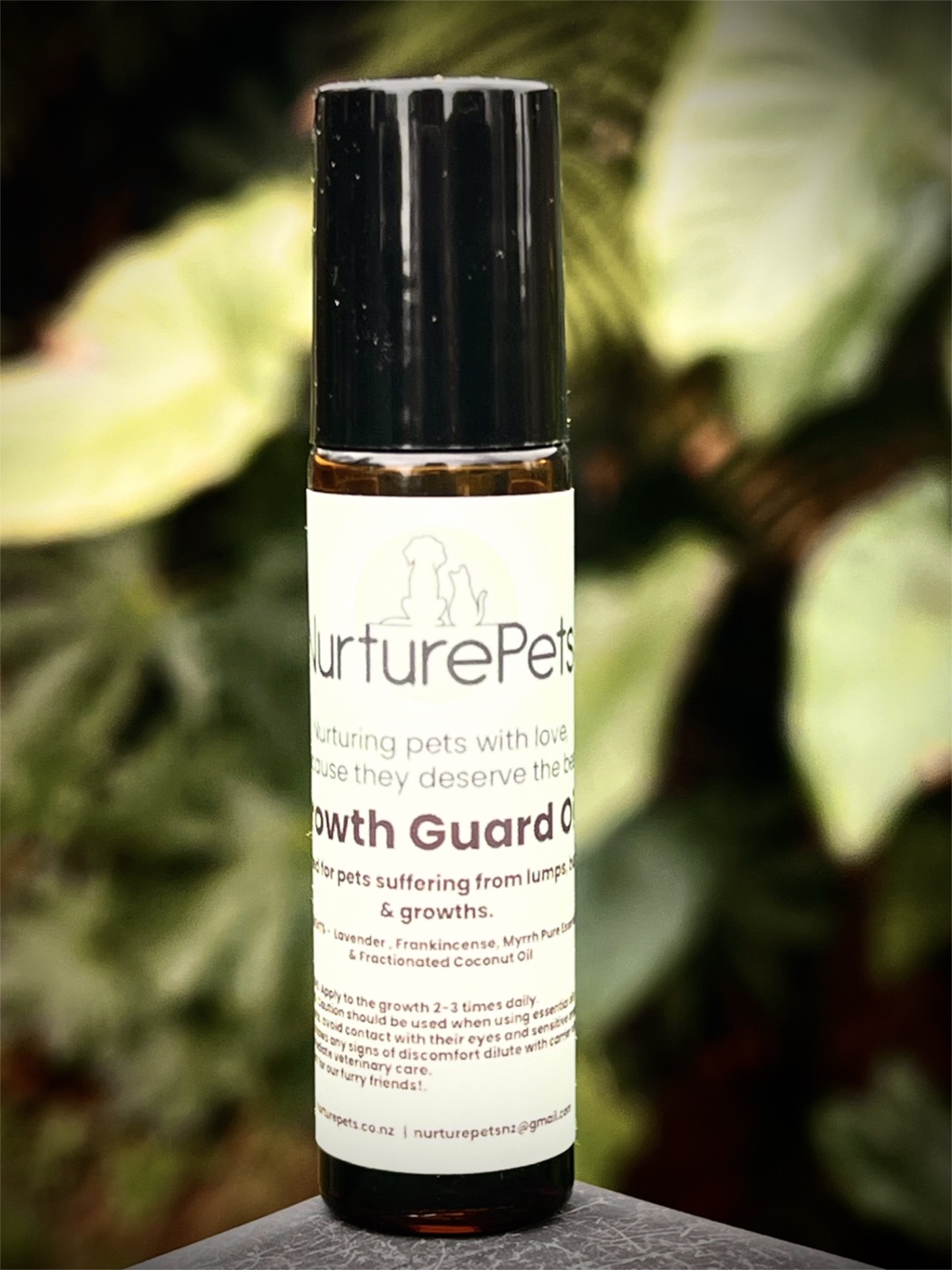 Nurture Pets Growth Guard essential oil roller on foliage