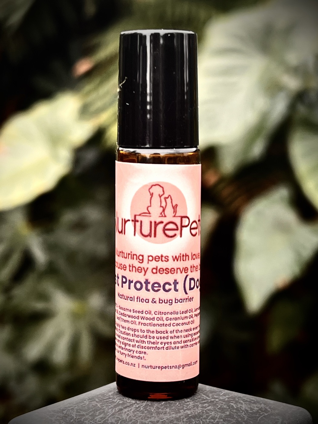 Nurture Pets Pest Protect essential oil roller on foliage